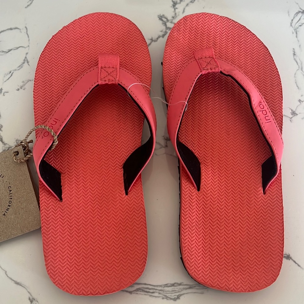 NWT. Indosole kids flip flops. Size 1/2. Color Coral.